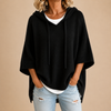 Gebreide poncho met capuchon en driekwartmouwen