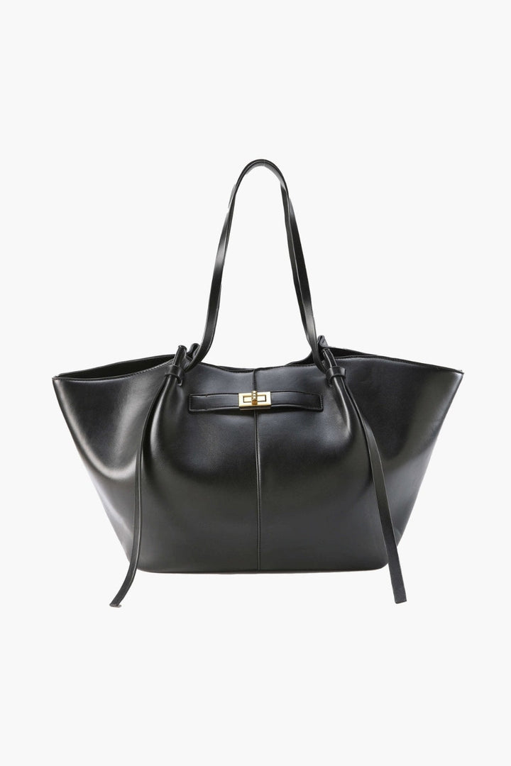 Leren shopper voor dagelijks gebruik met sluitingsdetail aan de voorkant.