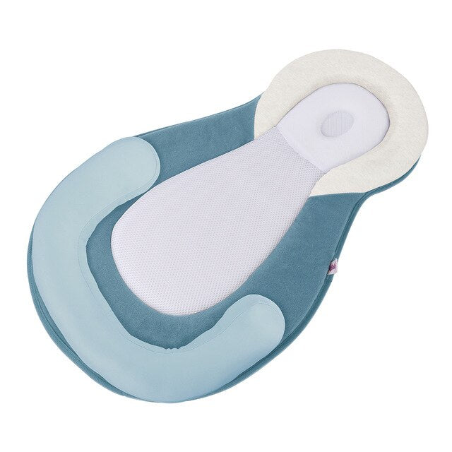 Ergonomisch draagbaar babynestje met hoofdsteun tegen een plat hoofdje – Schlafcocon