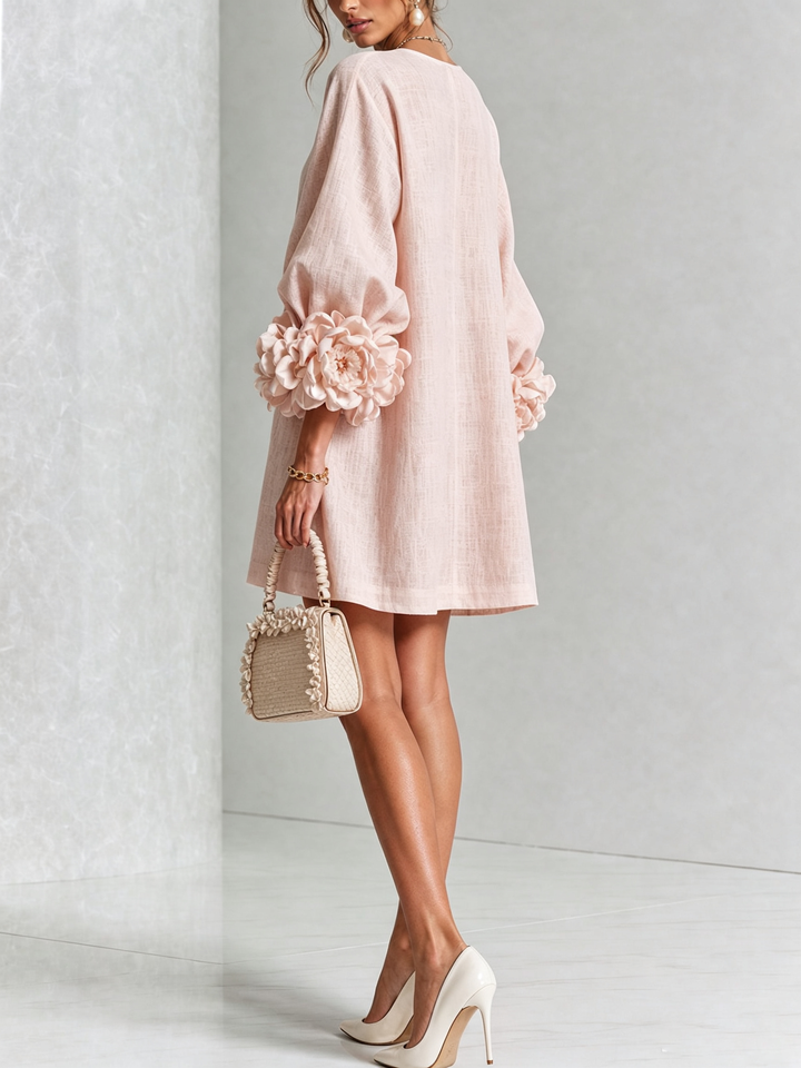 Elegante A-lijnjurk met volumineuze mouwen en bloemenknopen