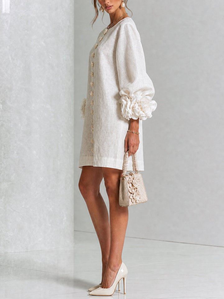 Elegante A-lijnjurk met volumineuze mouwen en bloemenknopen