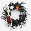 Halloween deurkrans met jack-o'-lantern-pompoenen en skelet voor feestdecoratie