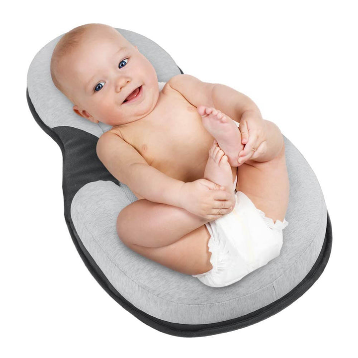 Ergonomisch draagbaar babynestje met hoofdsteun tegen een plat hoofdje – Schlafcocon