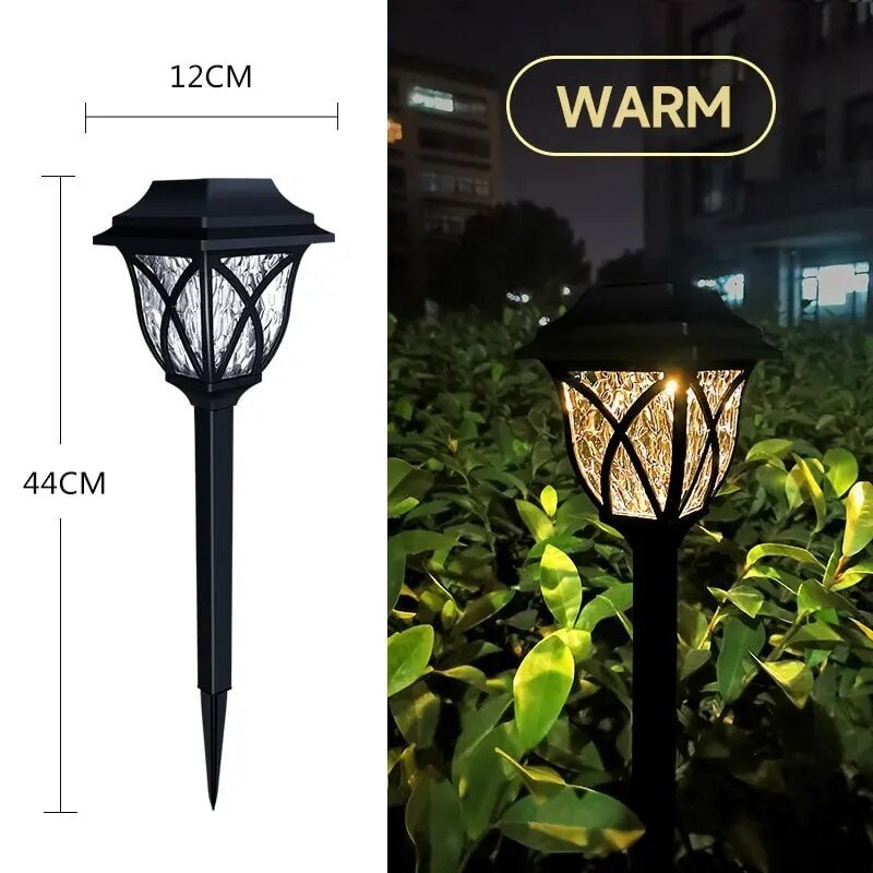 Zonne-energie padverlichting voor de tuin buiten met craquelé glazen lens en geïntegreerd paneel op prikker
