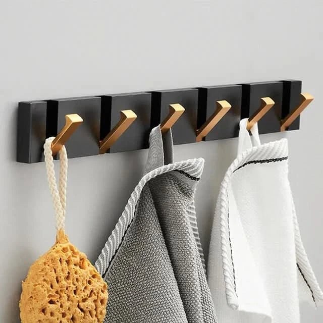 Wandgemonteerde moderne opvouwbare kapstok met intrekbare haken, ruimtebesparend