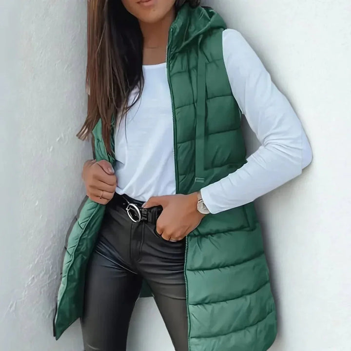 Lange mouwloze puffer gilet met capuchon