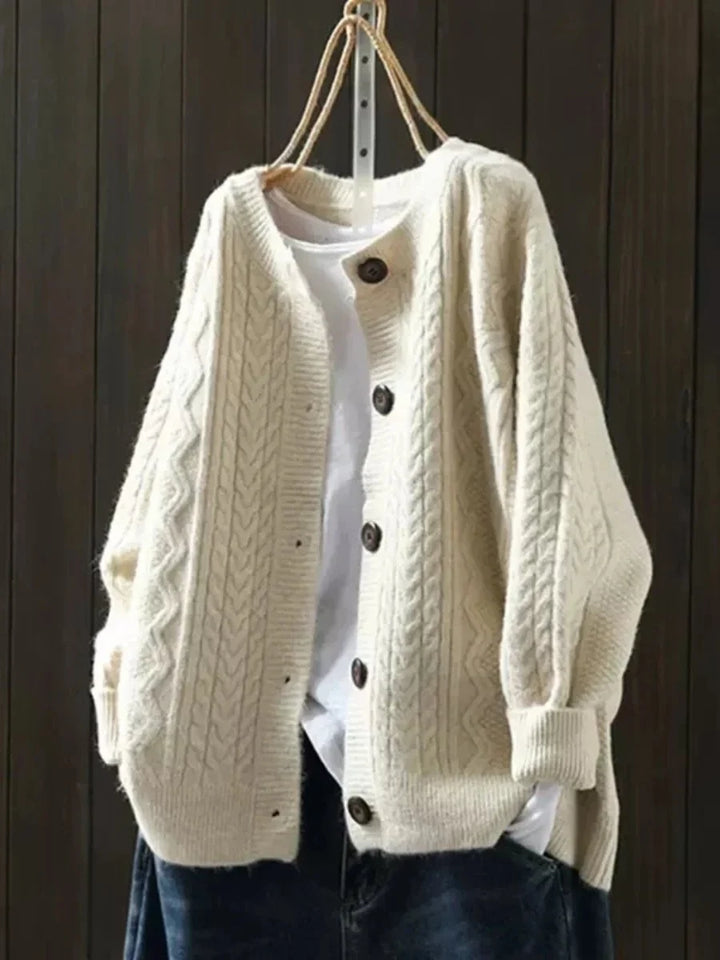 Oversized kabelbreivest met knopen