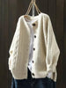Oversized kabelbreivest met knopen