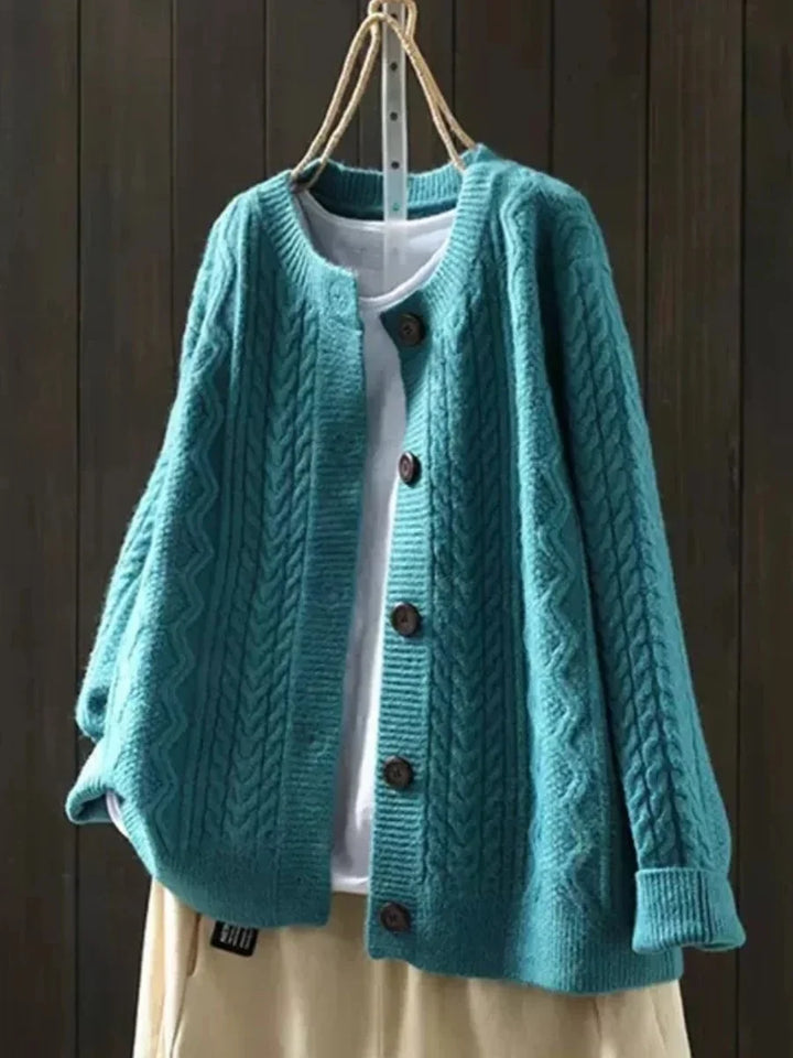 Oversized kabelbreivest met knopen