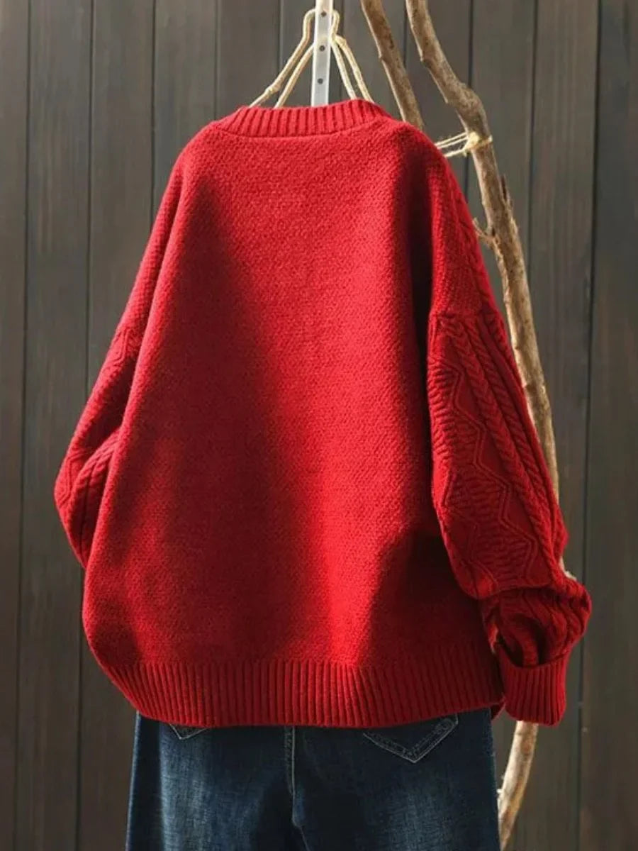 Oversized kabelbreivest met knopen