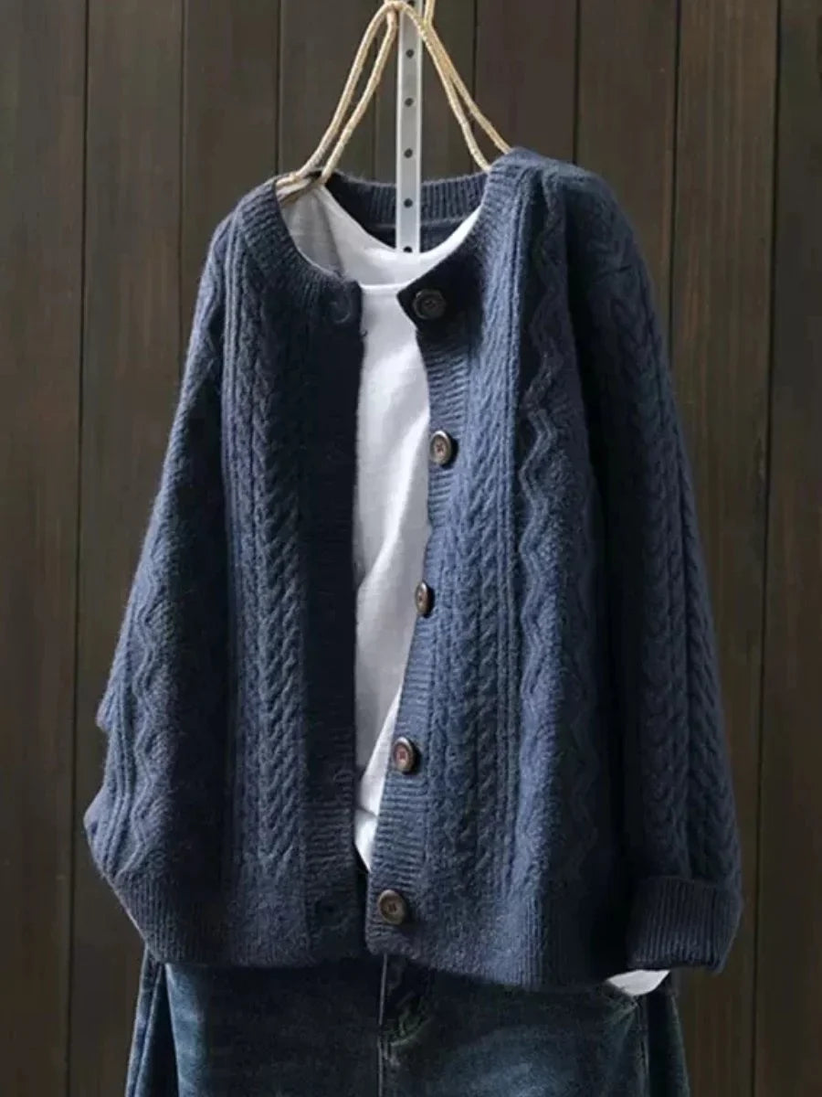 Oversized kabelbreivest met knopen