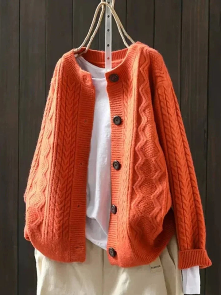 Oversized kabelbreivest met knopen