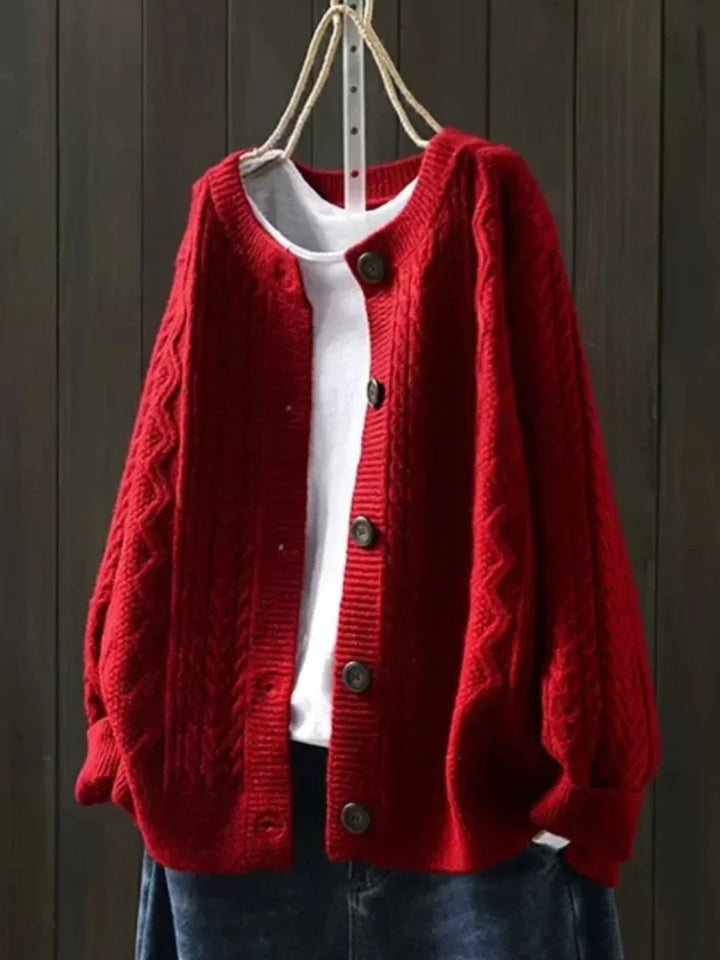Oversized kabelbreivest met knopen